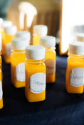 Load image into Gallery viewer, araam muslim girl wellness gathering — Araam Gala (Dallas) — Araam-branded fresh pressed juices, July 2025
