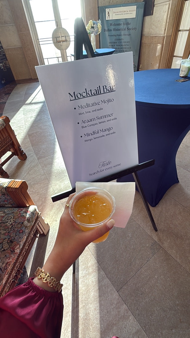 araam muslim girl wellness gathering — Araam Gala (Dallas) — mocktail bar sign and drink in hand, July 20, 2025