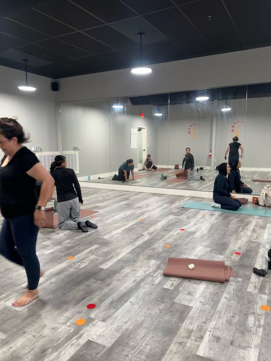 araam girl muslim girl wellness pilates yoga — Heated SlowFlo Pilates Class — class in session on mats in the studio (video still), August 31, 2025