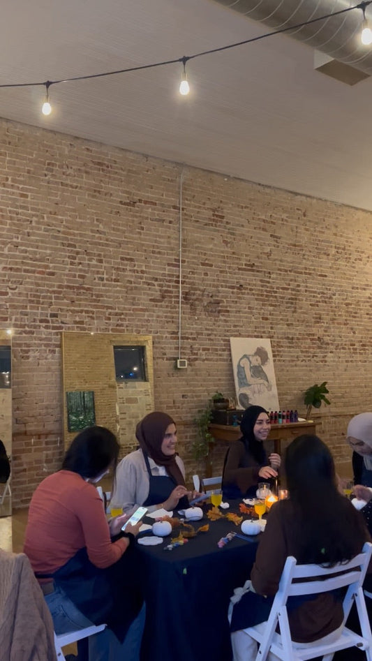 araam muslim girl wellness gathering — Matcha & Masterpiece Night (ft. Matcha Haus) — girls painting and sharing matcha around the table (video still), fall 2025
